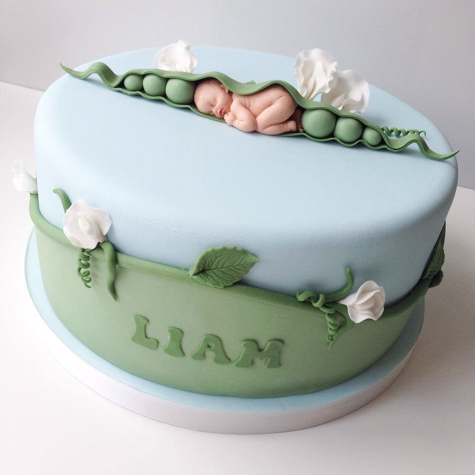 A baby-blue christening cake with sugar roses